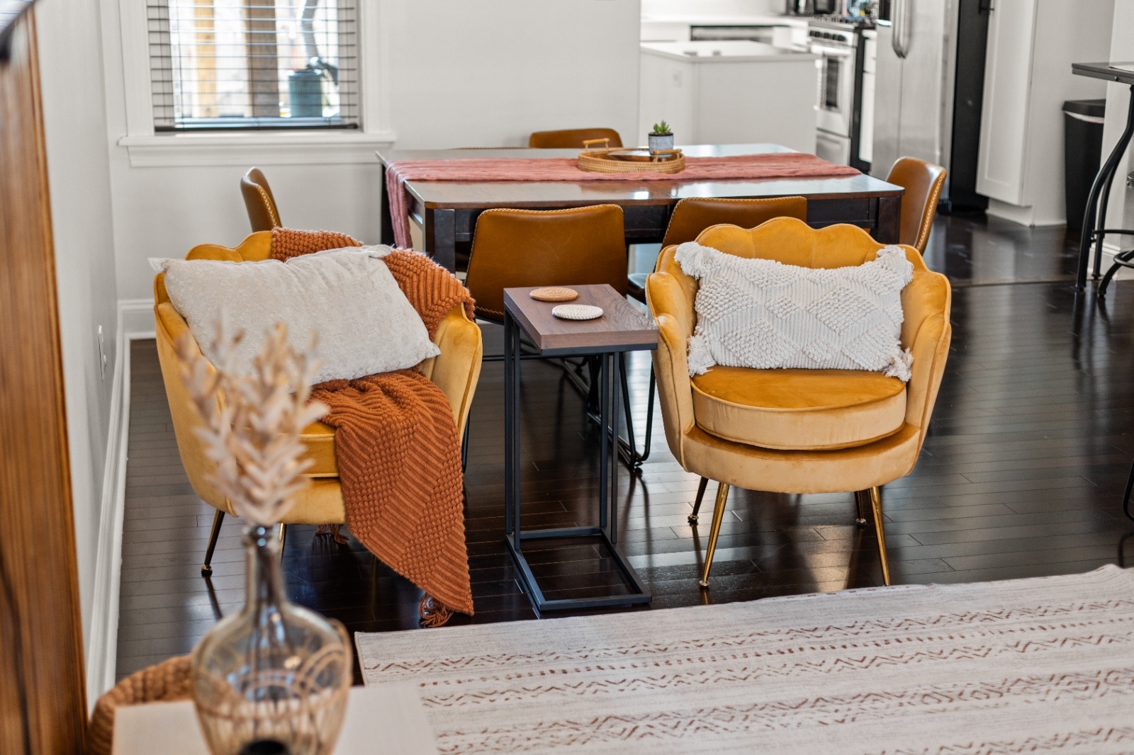 Luxury on Lemon Dining Area for Bachelorette Weekend Dining area inside Luxury on Lemon Lancaster Airbnb with mustard accent chairs and table set for group gatherings during a bachelorette stay.