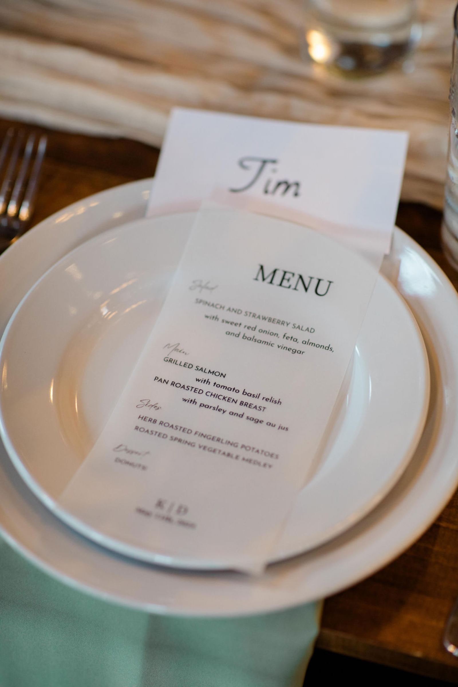Wedding reception place setting at Historic Ashland featuring personalized menu cards and greenery-toned linens.