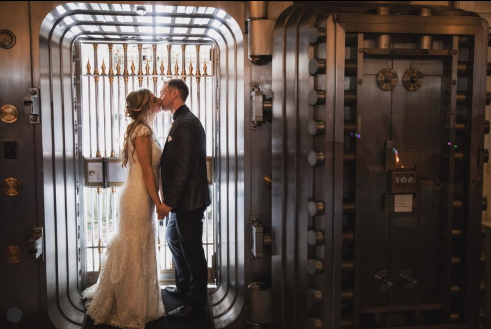 Bride and groom kissing inside the historic bank vault at Hotel Gettysburg in Gettysburg, PA.