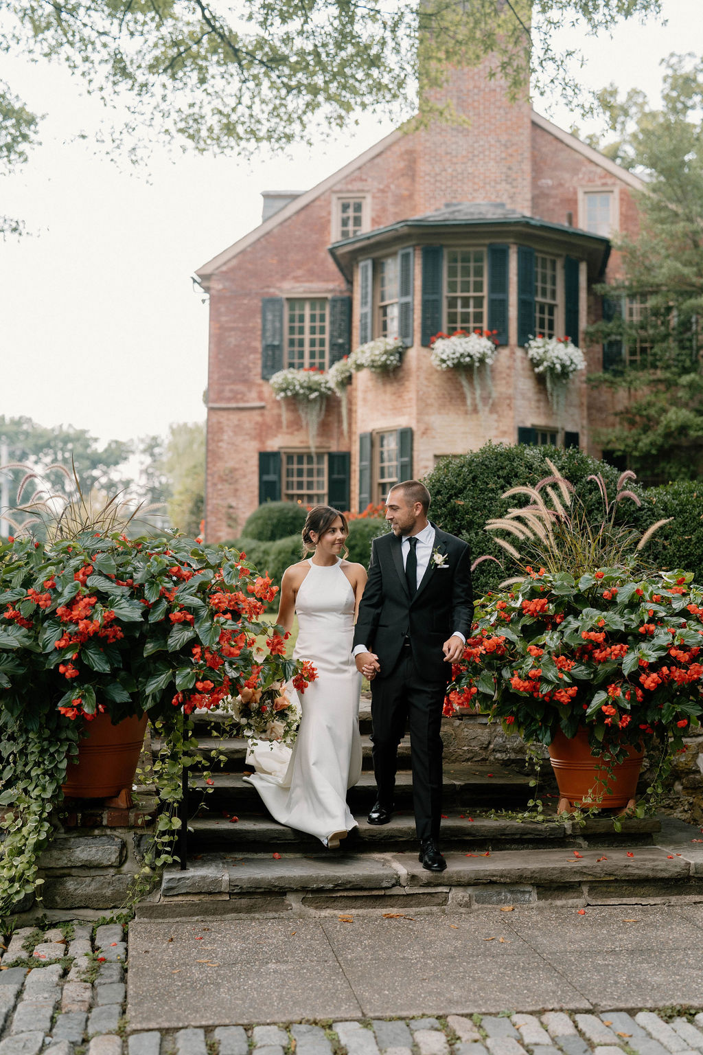 Garden Wedding Portrait at Conestoga House and Gardens Bride and groom walking through the gardens at Conestoga House and Gardens wedding venue in Lancaster Pennsylvania