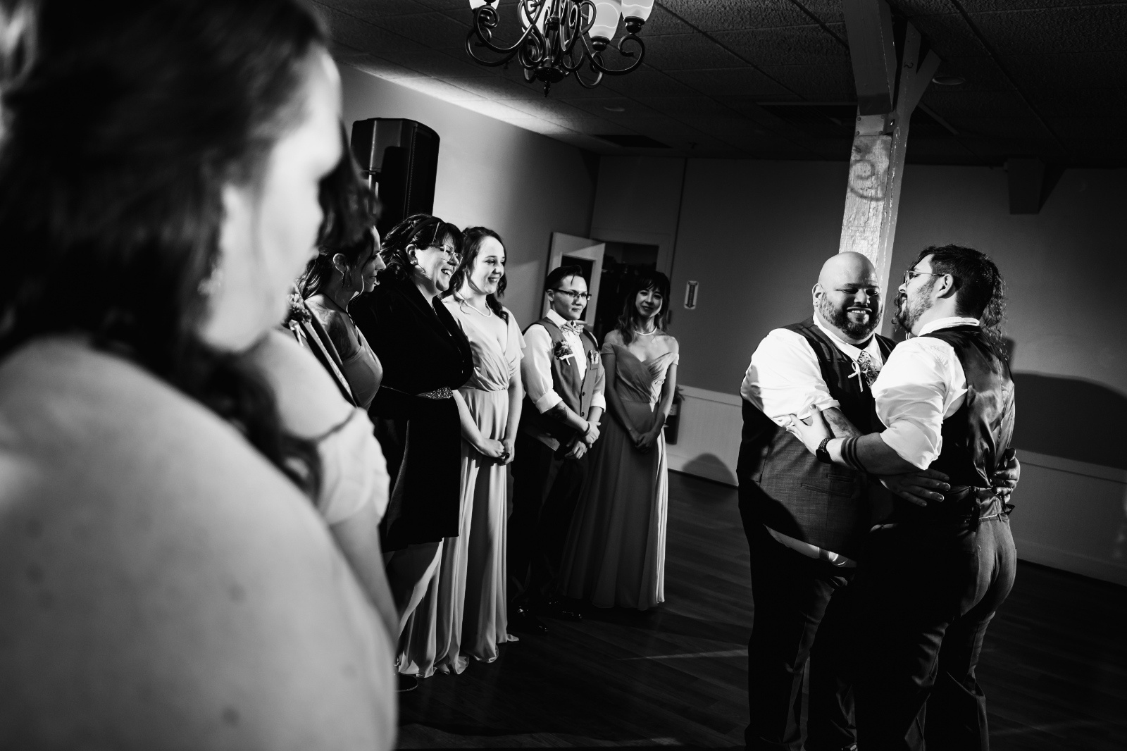 Couple shares an emotional first dance surrounded by family and friends during their Pennsylvania wedding reception.