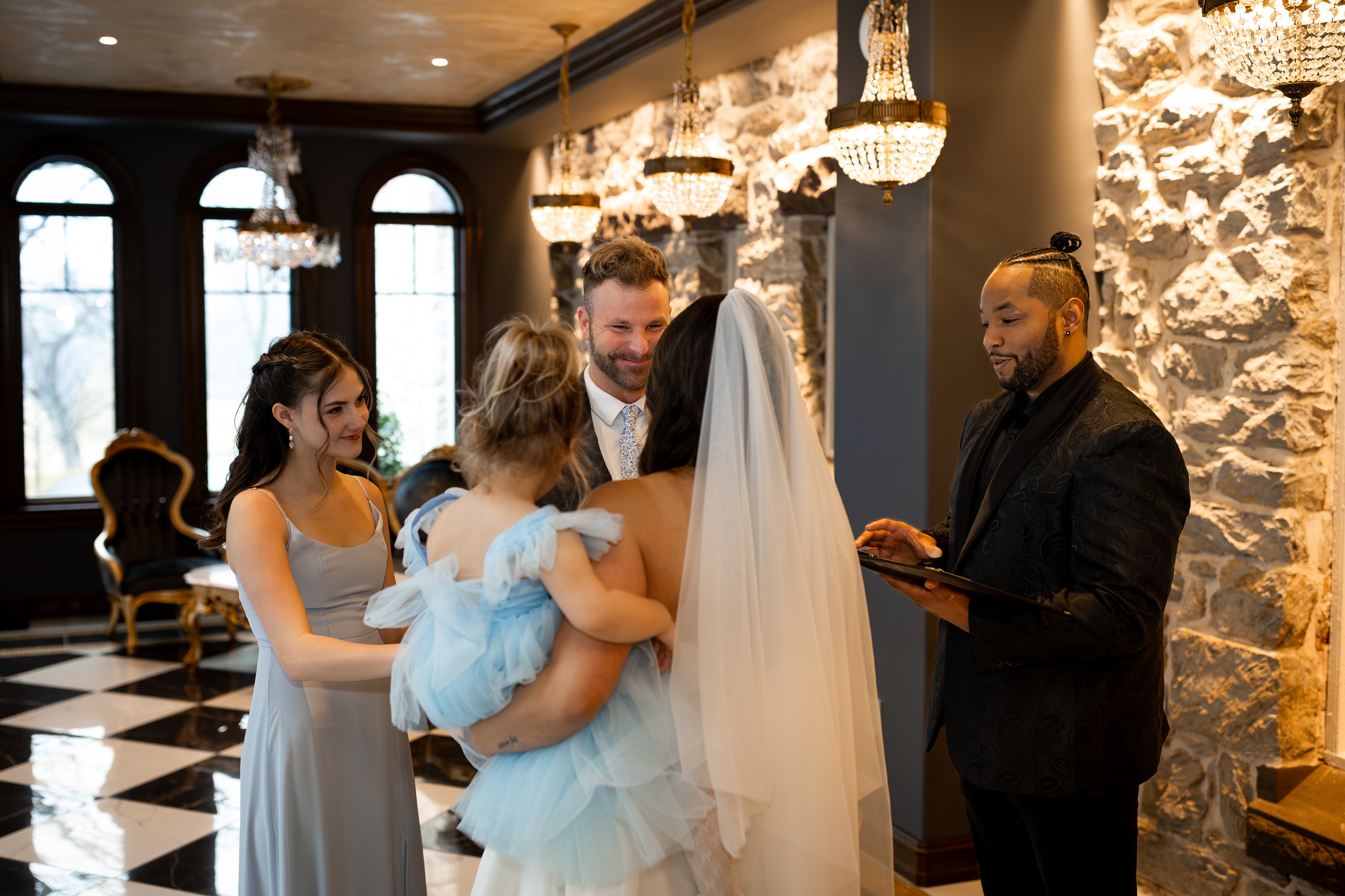 Bride and groom exchange vows with their daughters during an intimate Pennsylvania elopement ceremony officiated by TheBROfficiant at The Willows at Ashcombe.