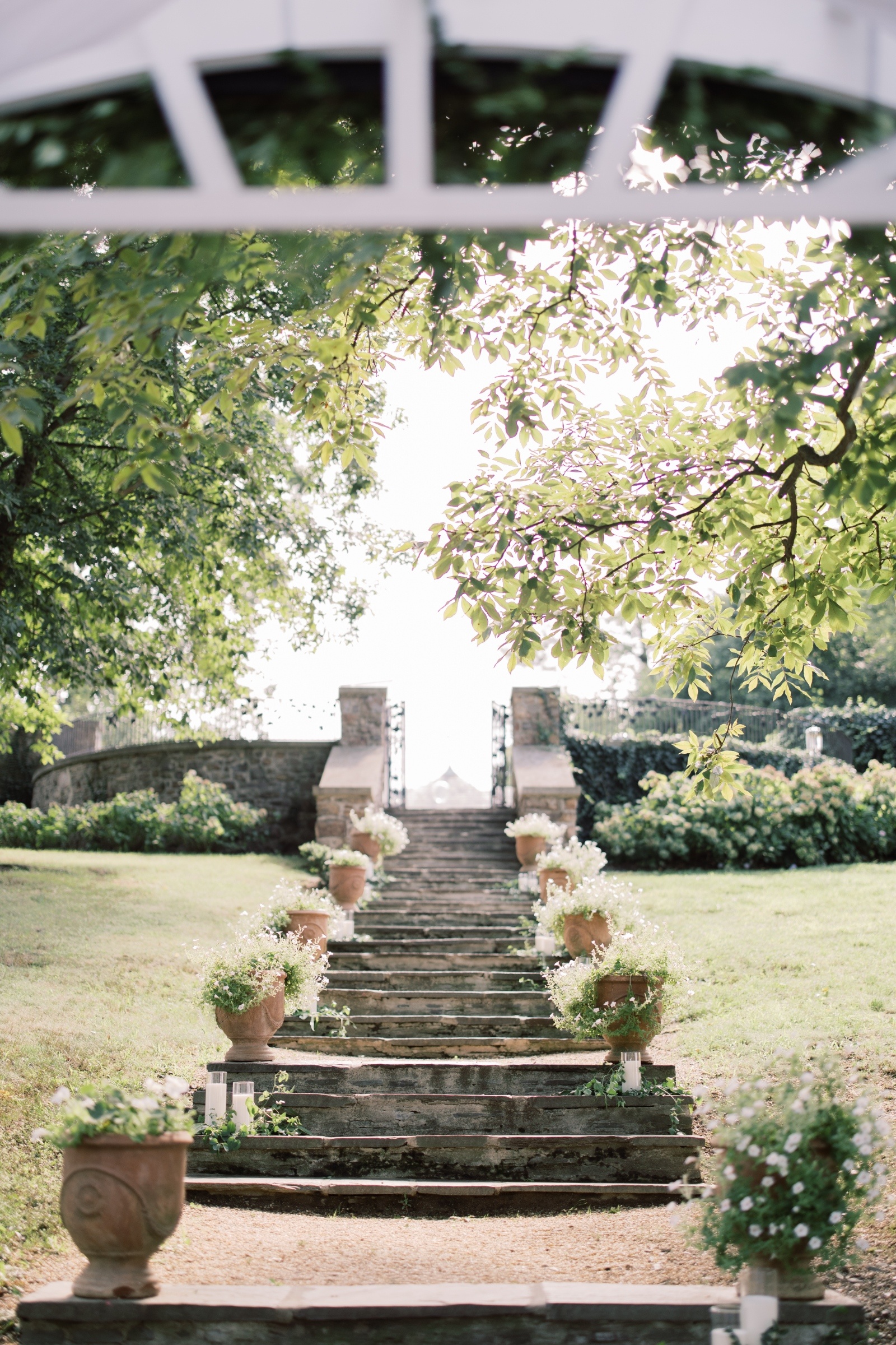 Sunken Gardens Ceremony Steps at Lauxmont Farms Stone ceremony steps lined with flowers at the Sunken Gardens at Lauxmont Farms wedding venue in Wrightsville Pennsylvania