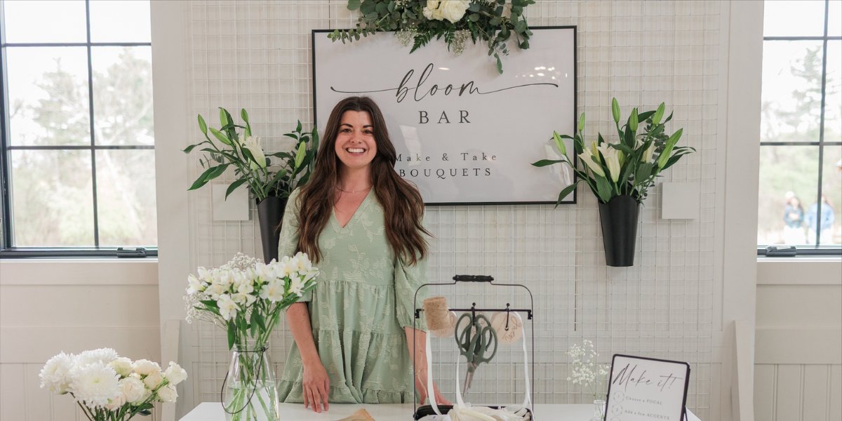 Selah Floral Studio owner standing at a custom wedding bloom bar in Howard, PA.